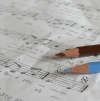 Colored pencils on sheet music